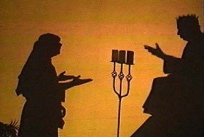 A shadow screen of two men dressed in Bible costumes.