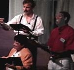 Three people read scripts in a Choral Reading.